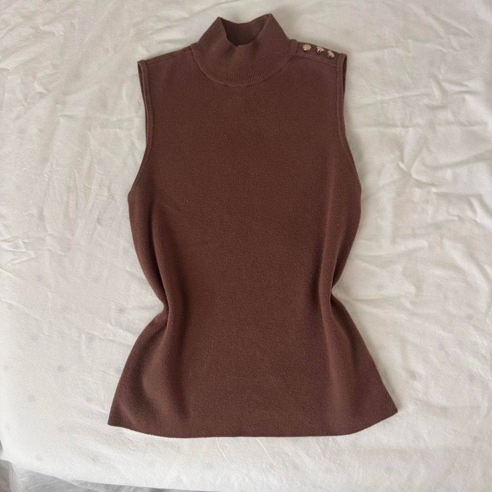 Brown sleeveless mock neck sweater and‎ button detailing